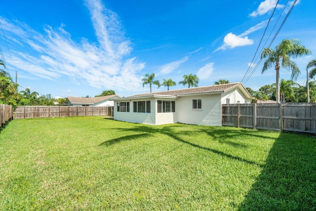 back of house with a yard