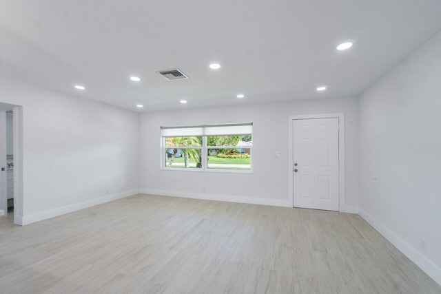 unfurnished room featuring light wood-type flooring