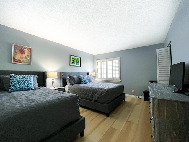 bedroom with light wood-type flooring