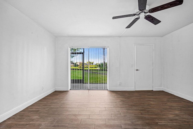 empty room with dark wood-type flooring and ceiling fan