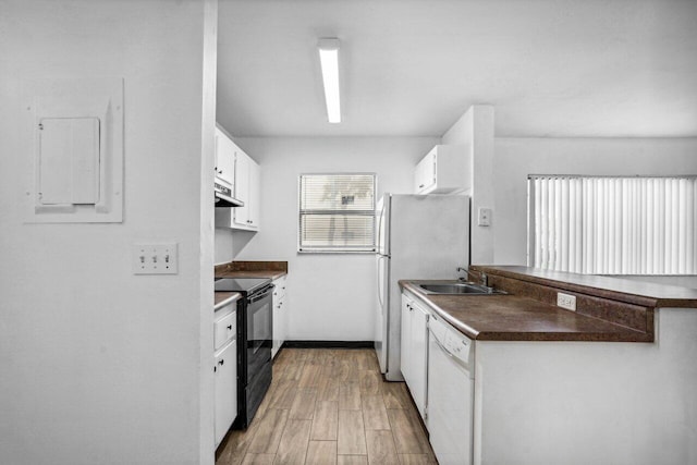 kitchen featuring sink, electric panel, white dishwasher, white cabinets, and black range with electric cooktop