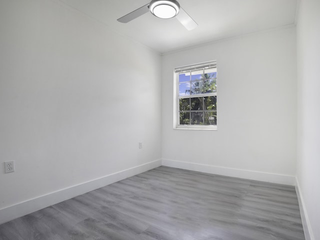 unfurnished room featuring hardwood / wood-style flooring and ceiling fan