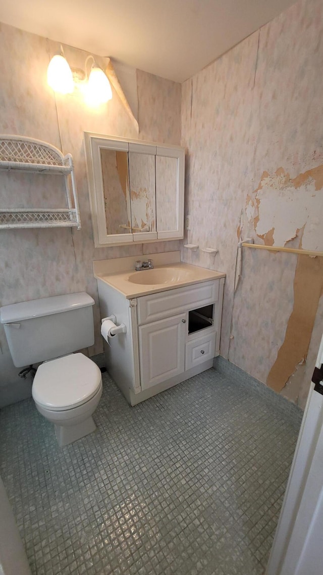 bathroom featuring vanity and toilet