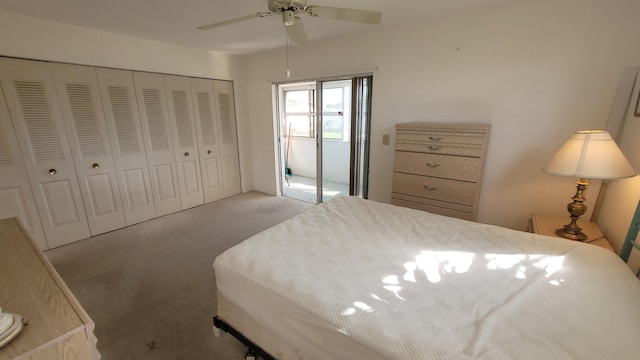 carpeted bedroom with ceiling fan and a closet