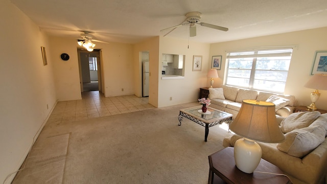 living room featuring light colored carpet and ceiling fan