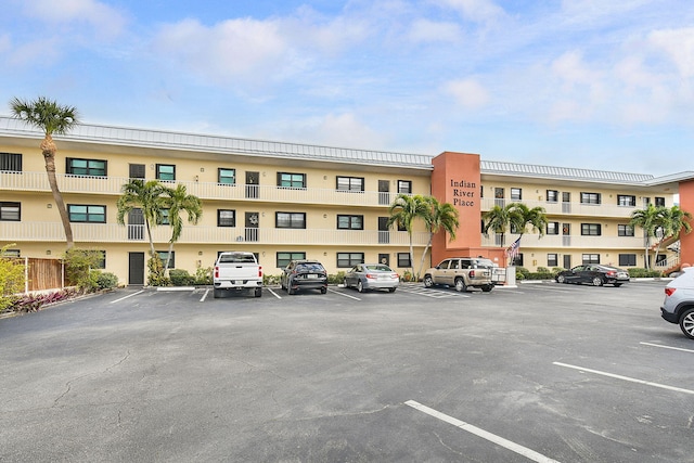 view of property featuring uncovered parking