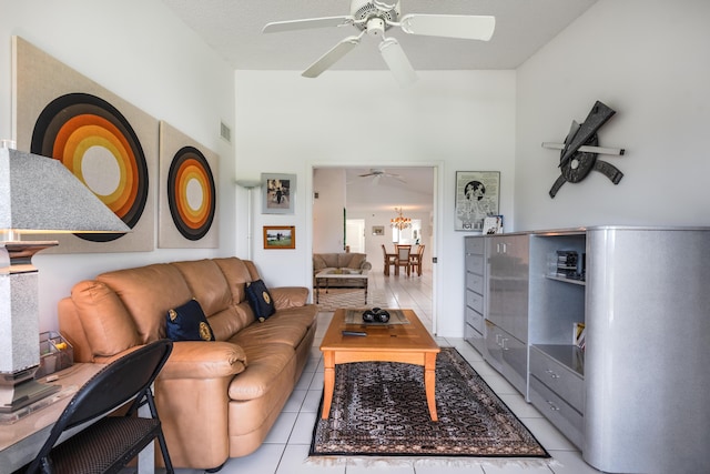 tiled living room with ceiling fan