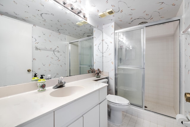 bathroom with vanity, an enclosed shower, tile patterned floors, and toilet