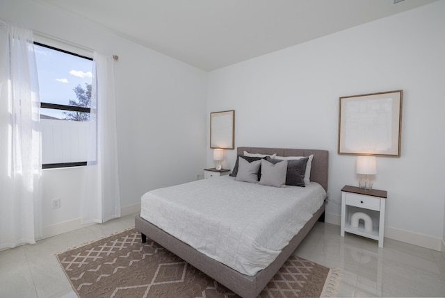 bedroom featuring light tile patterned floors