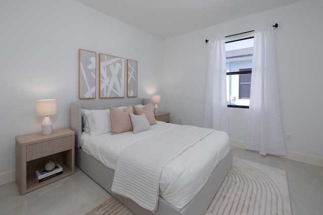 bedroom with light tile patterned flooring