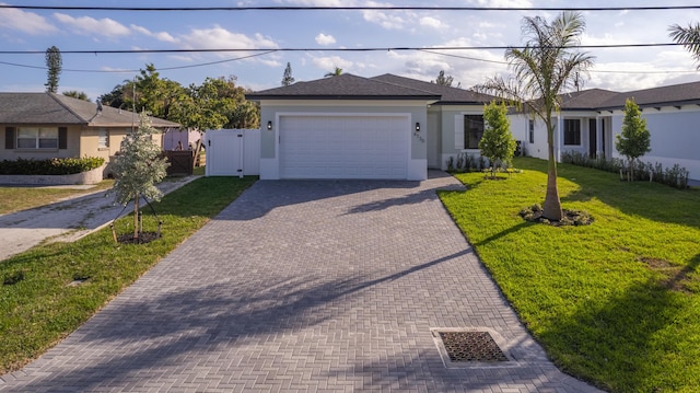 single story home with a garage and a front yard