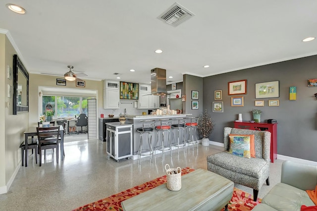 living room with crown molding and ceiling fan