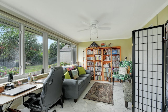 home office featuring ornamental molding, light tile patterned flooring, and ceiling fan