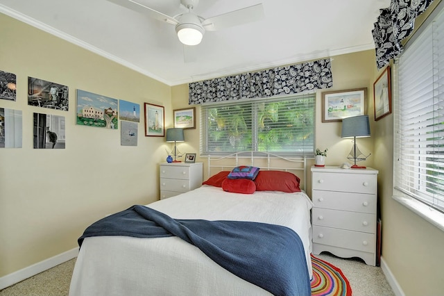 bedroom with multiple windows, crown molding, and ceiling fan