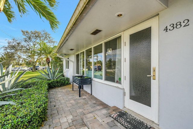 doorway to property featuring a patio