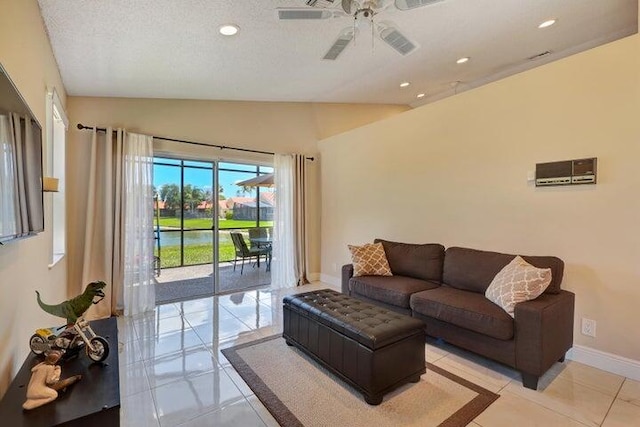 tiled living room featuring ceiling fan, vaulted ceiling, and a textured ceiling