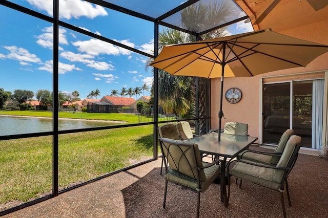 sunroom with a water view