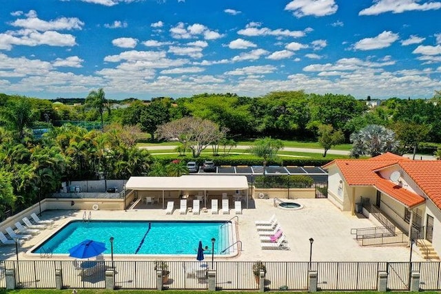 view of swimming pool with a patio area