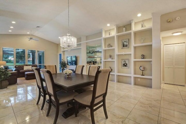 dining room featuring lofted ceiling, built in shelves, and ceiling fan with notable chandelier