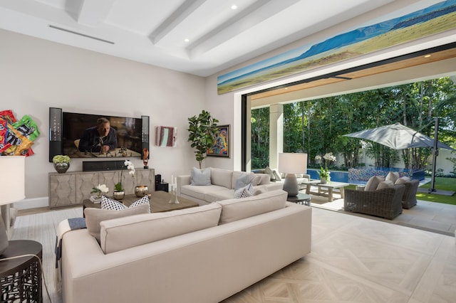 living room featuring light parquet flooring and beam ceiling