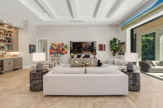 living room featuring light parquet flooring, wet bar, wine cooler, and beam ceiling