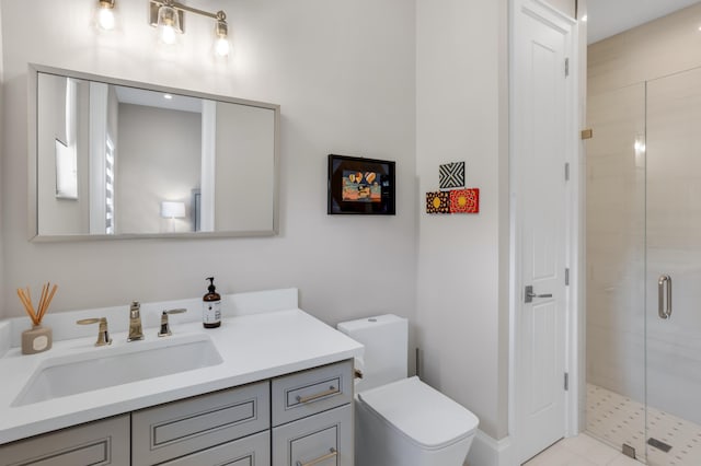 bathroom with an enclosed shower, vanity, and toilet