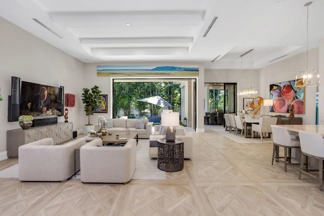 living room with light parquet floors, beamed ceiling, and a chandelier