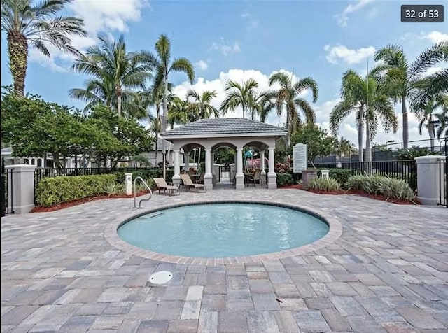 view of swimming pool featuring a gazebo and a patio area