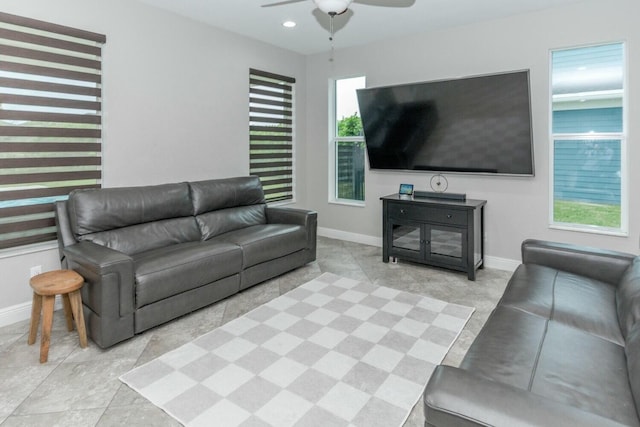 living room with light tile patterned floors and ceiling fan