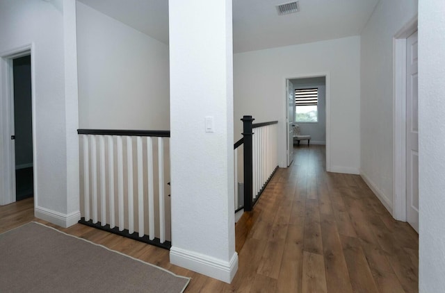 corridor featuring dark wood-type flooring