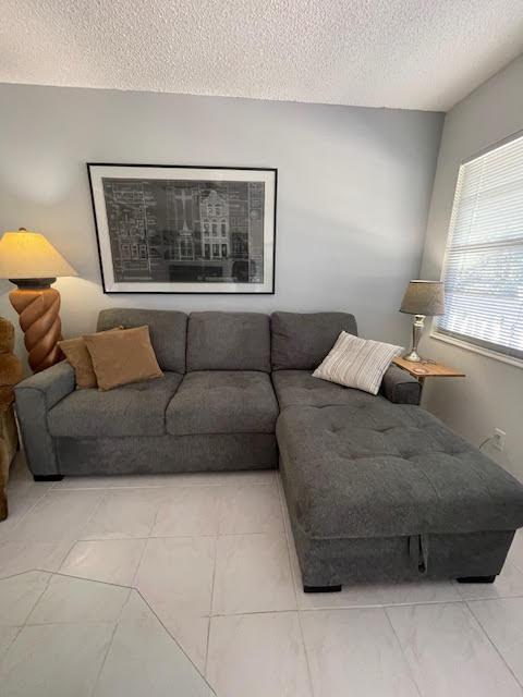 living room featuring a textured ceiling