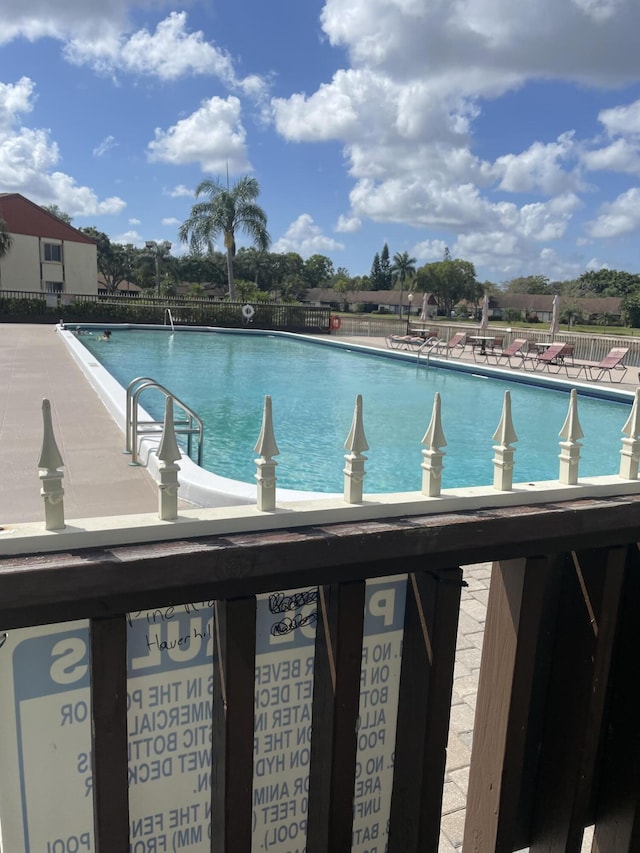 pool featuring fence