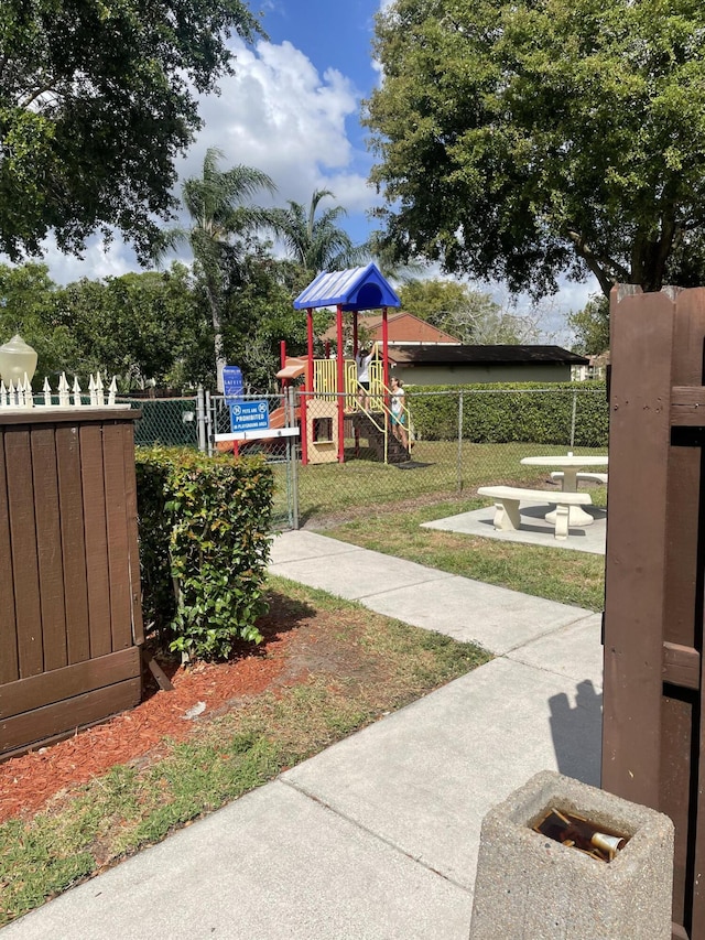 view of yard with fence and playground community