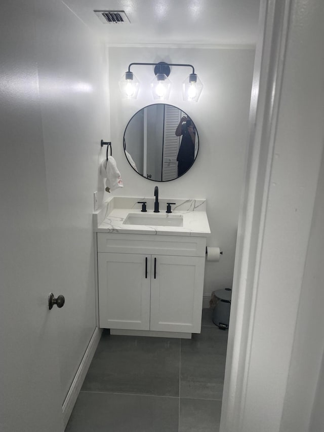 bathroom with vanity, tile patterned floors, and toilet