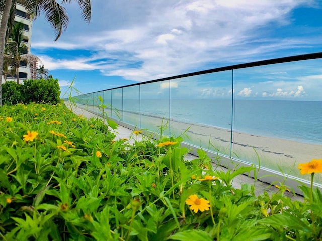 exterior space featuring a water view and a view of the beach