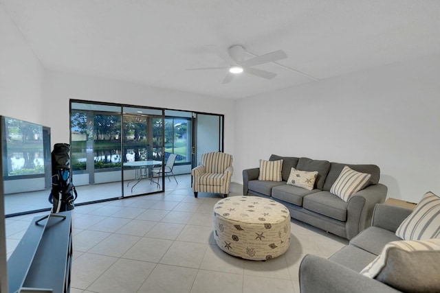 tiled living room with ceiling fan