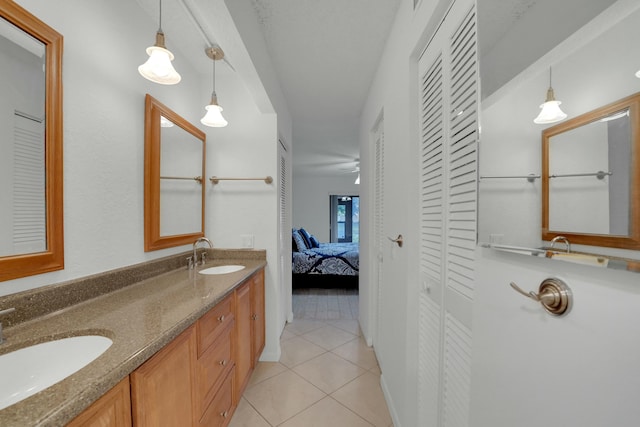 bathroom with tile patterned floors and vanity