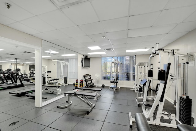 exercise room featuring a drop ceiling