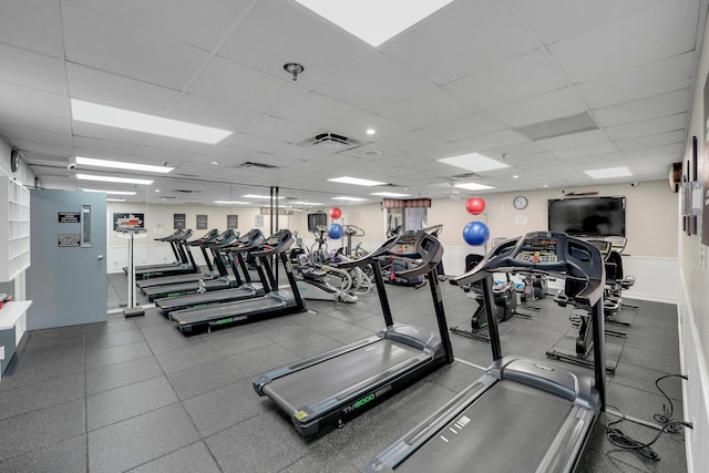 gym featuring a drop ceiling