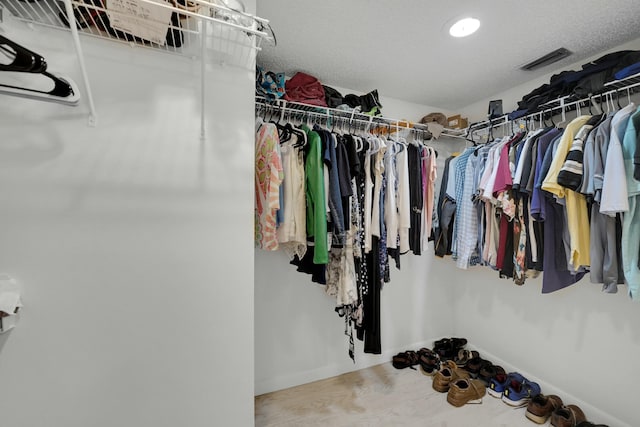 spacious closet featuring hardwood / wood-style floors