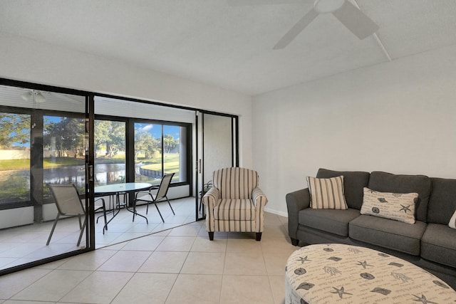 tiled living room featuring ceiling fan