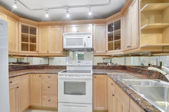 kitchen with open shelves, light brown cabinetry, glass insert cabinets, a sink, and white appliances