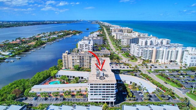 aerial view featuring a water view and a city view