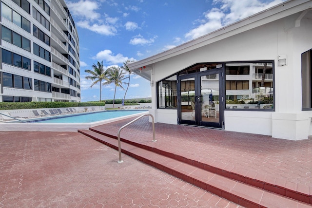 pool featuring a patio and french doors