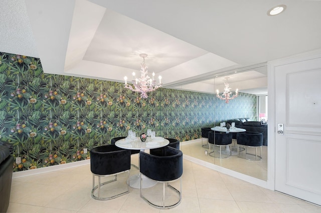 tiled dining area with a notable chandelier, recessed lighting, a raised ceiling, baseboards, and wallpapered walls