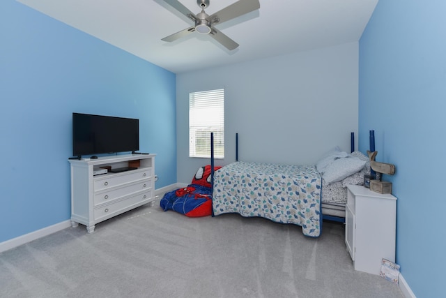 bedroom featuring ceiling fan and light carpet