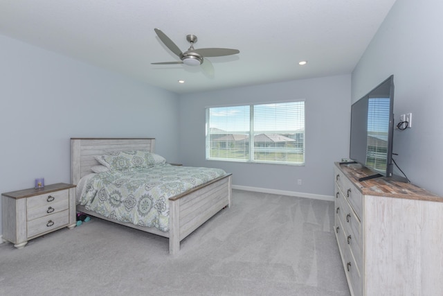 bedroom featuring light colored carpet and ceiling fan