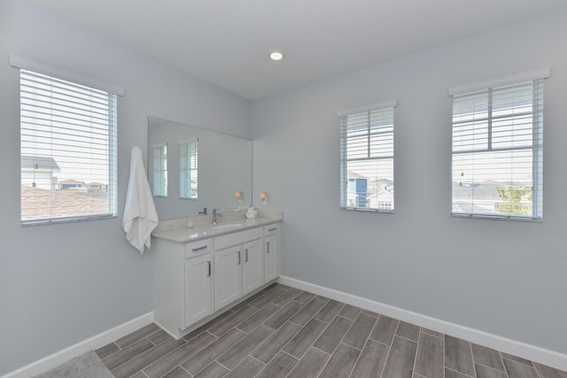 bathroom with vanity and a wealth of natural light