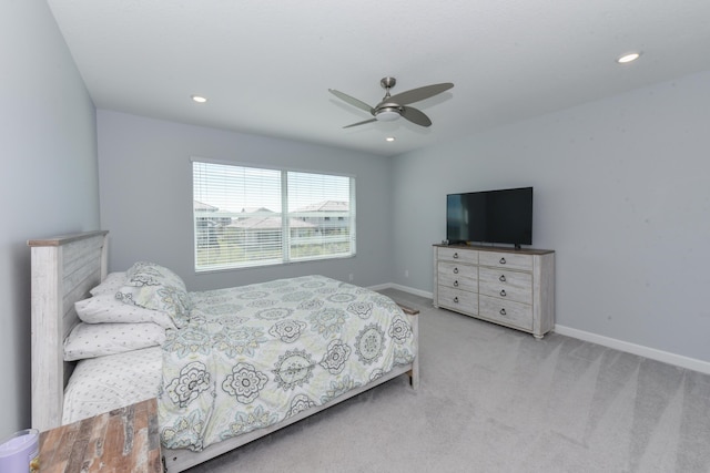 bedroom featuring ceiling fan and light colored carpet