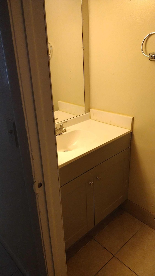 bathroom with tile patterned flooring and vanity